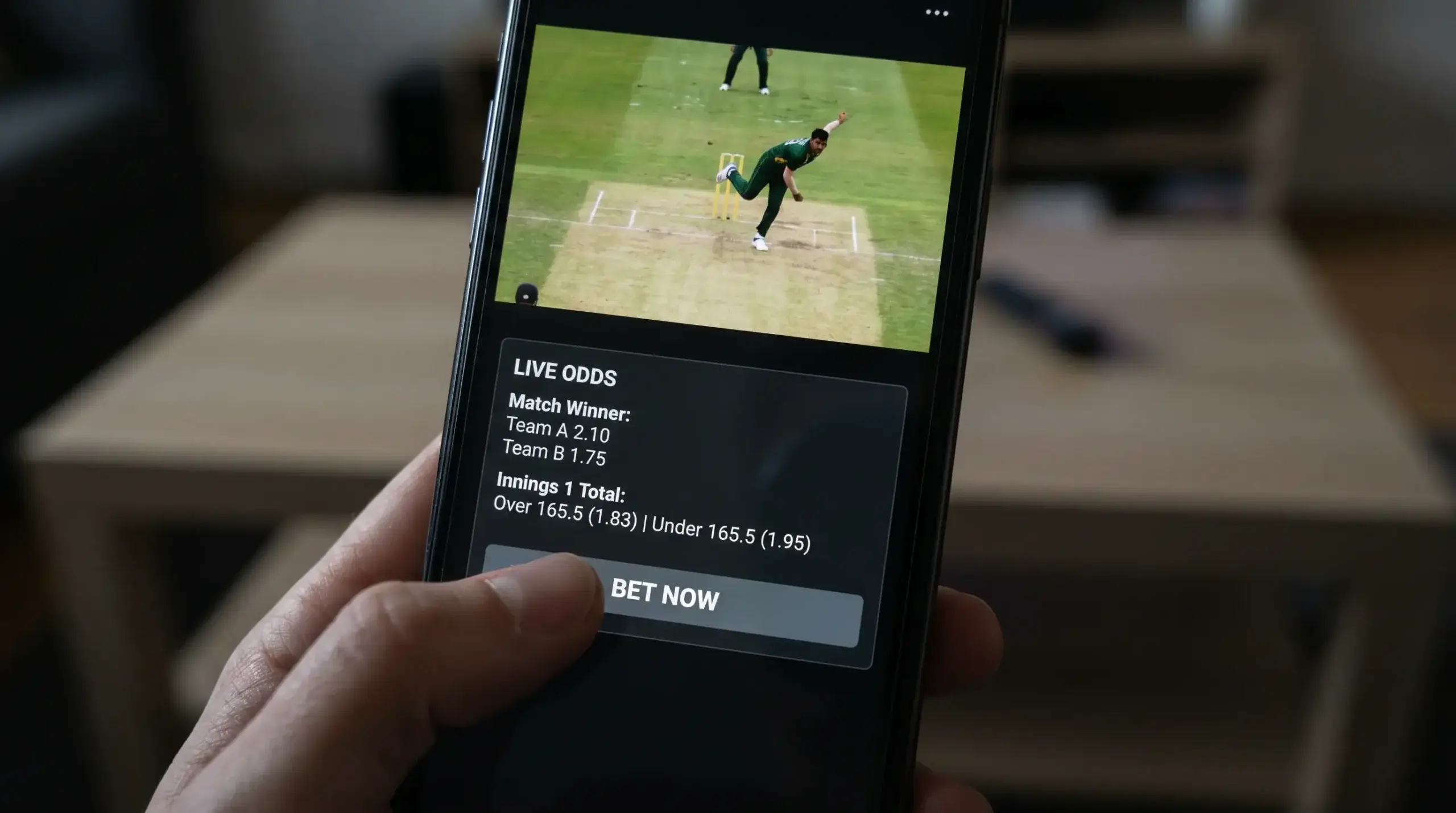 Smartphone displaying a live cricket stream embedded next to the betting interface