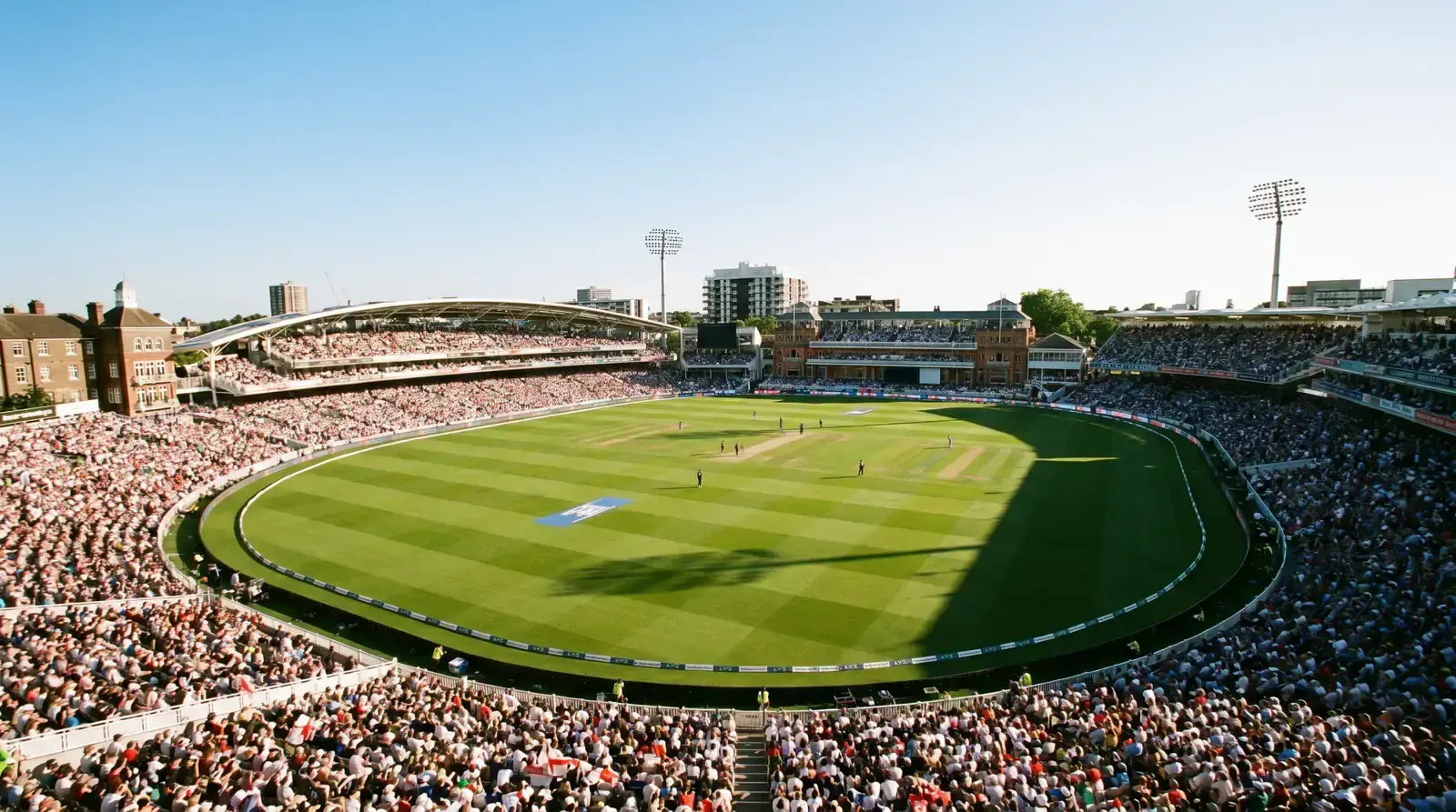 Aerial view of a cricket stadium during a professional match